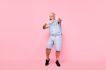 Full length photo of pretty funky retired guy wear jeans waistcoat having fun dancing isolated pink color background