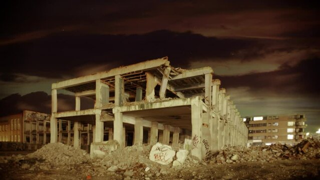 A Slow Motion Pan Of An Old And Derelict Building During The Night.