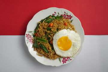 indomie fried noodles with red and white background  