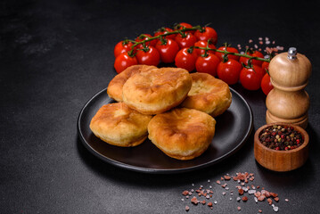 Traditional homemade pies with cabbage and sauerkraut on the plate