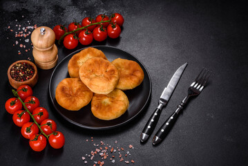 Traditional homemade pies with cabbage and sauerkraut on the plate