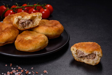Traditional homemade pies with cabbage and sauerkraut on the plate