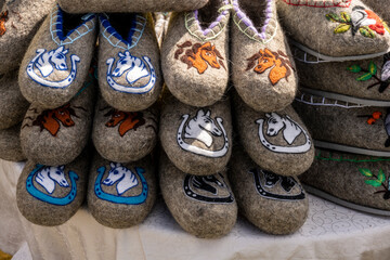 Souvenirs in the form of a horse's head at the festival of horses on a sunny summer day