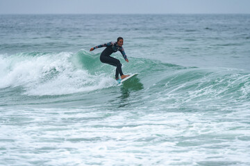 Surfer girl riding a wave