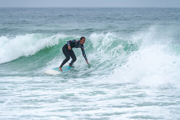 Surfer girl riding a wave