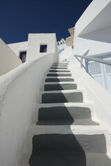 white houses and stairs in santorini island, greece