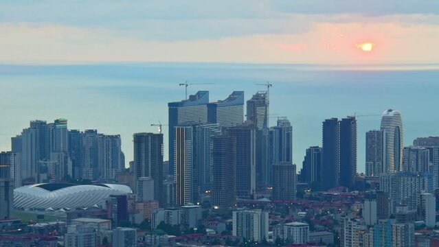 Panoramic zoom out View to Batumi coast and holiday stay hotel complex with black sea background. Vacation holidays in caucasus. Georgian vegas.
