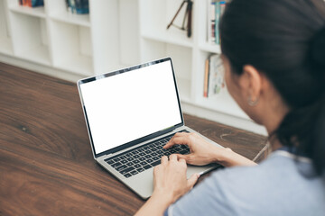 Fototapeta premium computer screen blank mockup.hand woman work using laptop with white background for advertising,contact business search information on desk at coffee shop.marketing and creative design