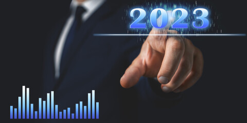Concept of business in 2023 year, businessman touches 2023 number