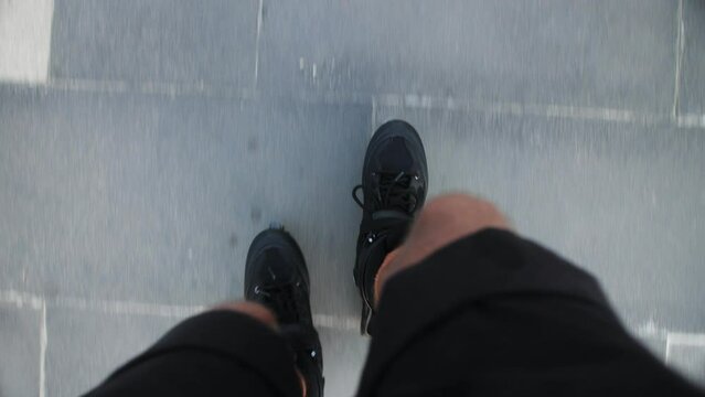 Speed Roller Skating On A Tar Cracked Road Outdoors, Pov Shot