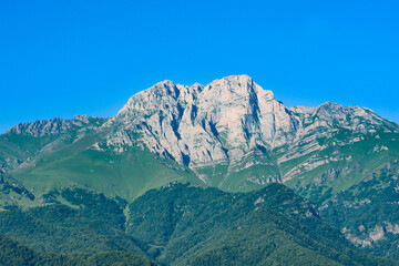 Fototapeta premium Mountain and amazing nature. Peak of the mountain. Top of Mount Khustup. Blue sky and beautiful mountain 