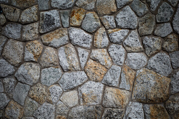 Background texture of Rough stone wall, Stone cladding, Old castle stone wall, Grey, brown Color, Close up shot
