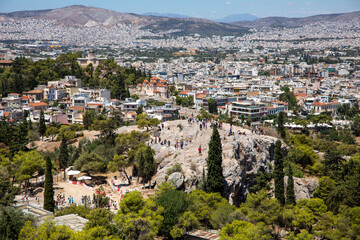 General view of Athens. View of the city on a sunny day with tourists from the Acropolis. Greece, July 2022.