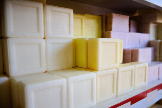 Natural traditional turkish bittim soap. Craft soap bars at traditional store counter. Pyramid of handmade soap with natural additives and extracts. 