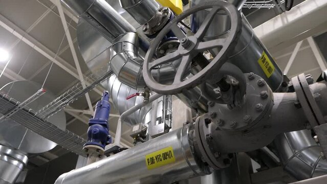 A slow motion video of steam boiler with a valve on a TPP