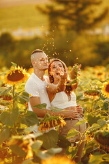 People spend time in a sunflowers field