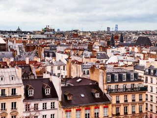 Roofs of houses and churches in Paris downtown