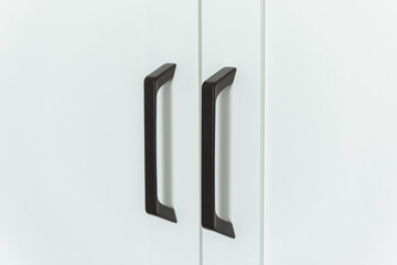 Door furniture cabinet handles in black and white contrast