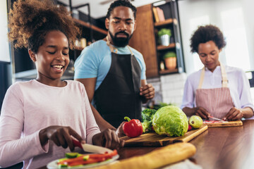 Fototapeta premium Happy multigenerational african american family make dinner together.