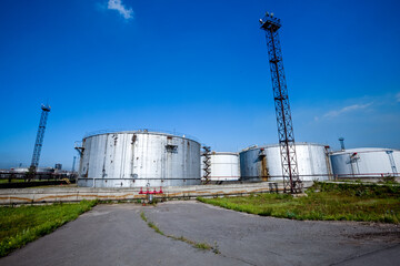 Refinery factory oil storage tank and pipelines. Oil and gas petrochemical industrial background