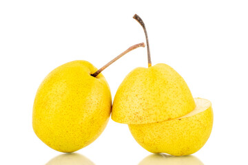 Two halves and one whole juicy yellow pear, close-up, isolated on a white background.
