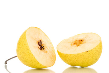Two halves of a juicy yellow pear, close-up, isolated on a white background.