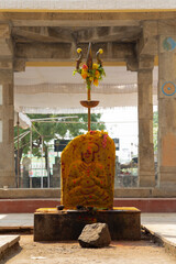 Carved Rock of a Hindu goddess temple with weapon Trishool