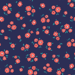 Seamless pattern of small red flowers on blue background. Floral vector print