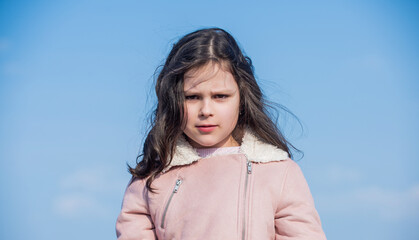 portrait of child with face on sky background