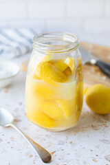 Making preserved Moroccan lemon with lemons and salt.