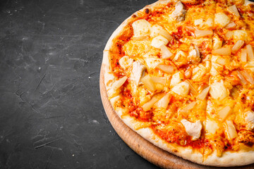 hot delicious traditional italian pizza on a dark stone background