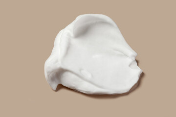 Shaving cream isolated on brown color background.