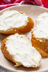 baguette cream cheese sandwich on a white background
