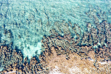 Aerial view of waves splashing on beach