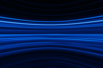 Blur glowing lines. Neon abstract background. Futuristic radiance. Defocused luminous navy blue color curve streak light flare motion on dark black.