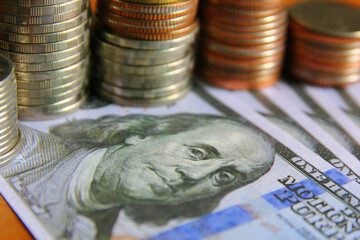 close up coins stack on American dollar bank note , money concept