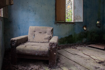 old chair in the abandoned house