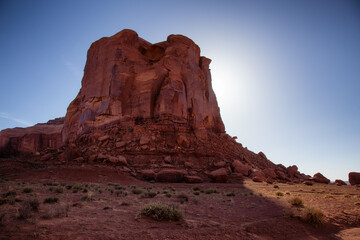 Fototapeta premium Desert Rocky Mountain American Landscape. Sunny Blue Sky Day. Oljato-Monument Valley, Utah, United States. Nature Background