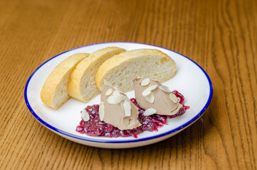pate with bread in a plate on the table