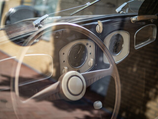 Dashboard and steering wheel of old-timer car