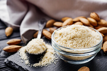 almond flour on a black wooden rustic background