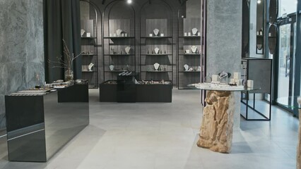 Tracking in view of contemporary luxury jewelry store at daytime