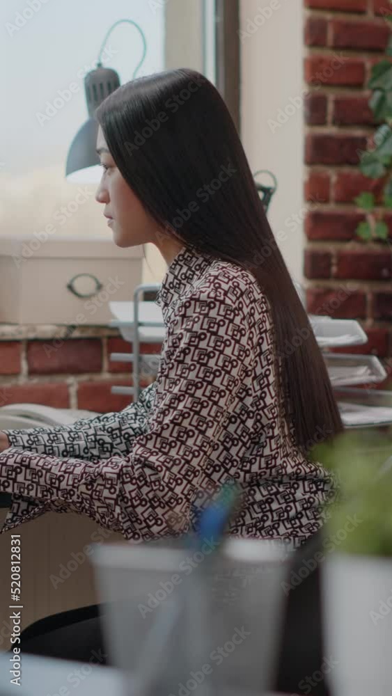 Poster vertical video: portrait of business woman working on computer to plan project in company office. st