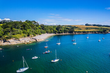 Aerial shot of Helford River with boats on summer day