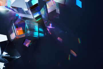 Geometric figures prisms with light diffraction of spectrum colors and reflection with trendy light