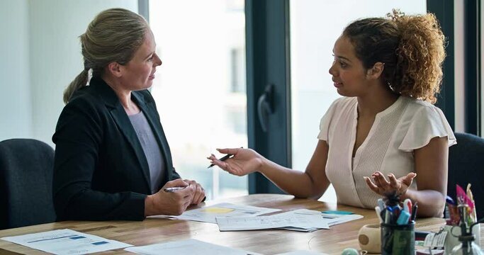 Finance lawyer discussing signing legal paperwork in a meeting at her law firm office. Confident, professional and serious attorney giving advice on the financial banking contract agreement to client