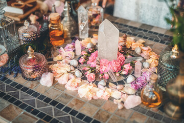 beautiful altar with crystals and rose flowers.