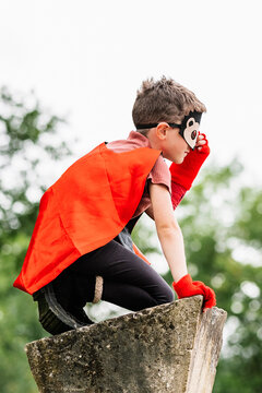 Superhero in hedgehog mask in park