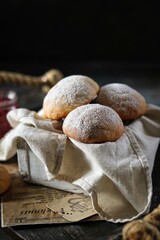 Cottage cheese buns with powdered sugar on the table 