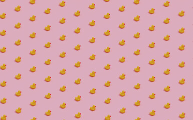 seamless pattern of rubber ducks on pink background